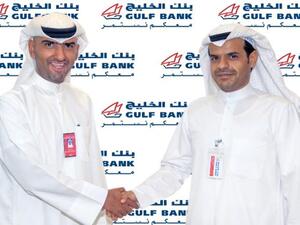 Musaed Al Mazyed, Area Manager congratulating Al Danah weekly winner, Saad Meshal Mezyed Al-Mutairi