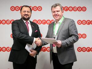 Waleed Al Sayed-CEO Ooredoo Qatar and Chris Dedicoat-EVP Worldwide Sales Cisco at MWC