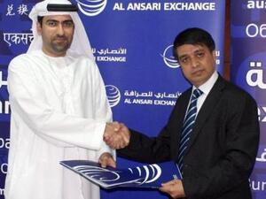 Chandra Prasad Dhakal, Executive Chairman of International Money Express and Rashed Ali Al Ansari, General Manager of Al Ansari Exchange taken after signing the agreement.