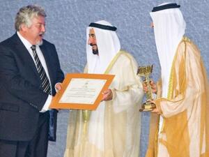 His Highness Dr Shaikh Sultan Bin Mohammad Al Qasimi, giving the certificate to Motivate Publishing
