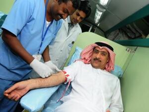 Mohamed Amiri, Acting CEO of Ajman Bank, donating blood in Khalifa branch