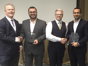 Ammar Al Ketbi and Abdulla Salmeen from Zain Bahrain receiving the awards