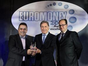 Andre Al Sayegh, CEO of FGB, Karim Karoui, Chief Financial Officer, First Gulf Bank, and Clive Horwood, Editor of Euromoney