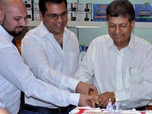 Anniversary cake cutting by Jacky Panjabi and his team