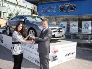 Amer Matouk, Head of Consumer Banking - Jordan at Arab Bank with the winner of the Grand Prize Ms. Nada Mohammad Sa’dat Habash