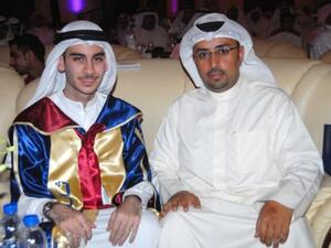 Talal Al Shgeih, who ranked first amongst Kuwaiti students, and Fahad Al Reshaid, Public Relations Manager at Burgan Bank