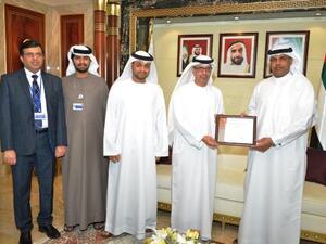 Juma Al Ghaith presents Ahmed Mahboob Musabih with the COBIT 5 certificate, in presence of Ahmad Al Yaqoobi, Project Delivery Director and Adel Al Hosani, Head of Information Security