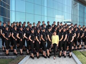 Dannii Minogue at Etihad Airways Headquarters in Abu Dhabi with the airline’s Grand Prix grid girls