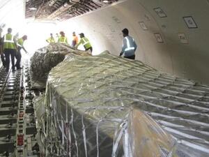 Dhow sailboats being loaded onto Etihad Cargo’s Airbus A330-200F freighter