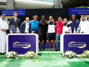 Emirates NBD officials with international football legends