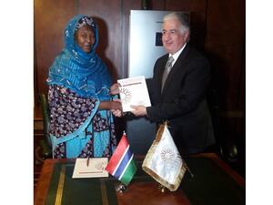 Eng. Hani Salem Sonbol and Mrs. Fatoumata Jallow-Tambajang at the signing ceremony.