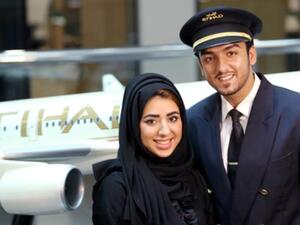Noora Al Marri, Etihad Airways’ 1,000th Emirati member of staff, with her husband, Faisal Al Naqbi, an officer cadet from batch 19 of the cadet pilot program