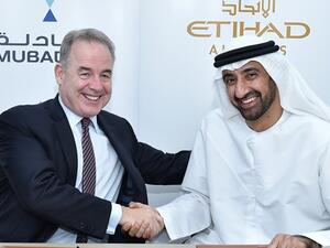 James Hogan, Etihad Airways’ President and Chief Executive Officer, with Homaid Al Shemmari, Chief Executive Officer, Aerospace and Engineering Services, Mubadala, after signing ‎an MoU to expand their companies' strategic partnership
