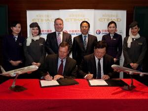 Etihad Airways Chief Strategy and Planning Officer Kevin Knight signing MoU with China Eastern Airlines Marketing Director Dong Bo