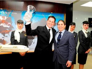 Etihad Airways Chief Commercial Officer Peter Baumgartner receives the award from Global Vice President Expedia Media Solutions Noah Tratt