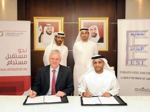 Richard Bowker CBE, CEO of Etihad Rail, and Saeed Ghumran Al Romaithi, Acting CEO at Emirates Steel during the signing