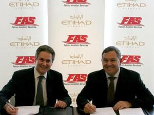 Peter Baumgartner, Etihad’s Chief Commercial Officer, and A.J. Baker, Falcon Aviation’s Vice President of Business Development and Strategy, during the signing