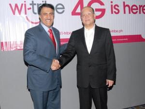 Sheikh Abdullah Bin Mohammed Bin Saud Al-Thani, Chairman of Qtel, with Ramon Ang, President and Chief Operating Officer of SMC, Philippines