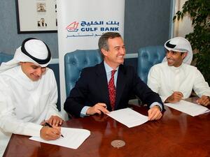 Gulf Bank CEO Cesar Gonzalez-Bueno at the signing ceremony with Ahmed Al Majed and Ahmed Al Huzami