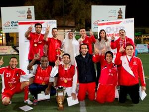 Mr. Fawzy Al-Thunayan, General Manager of Board Affairs and Ms. Salma Al Hajjaj, General Manager of Human Resources at Gulf Bank along with the winning team