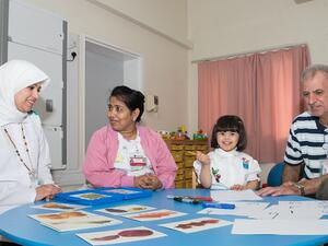 Haya Al Neemi with specialists from Child Development Center  