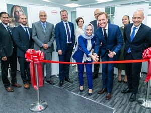 Jens-Martin Schwärzler, Executive Vice President Beauty Care (third from right) and Olfa Aouida, Head of R&D MEA, Beauty Care (sixth from left) during the ribbon cutting.
