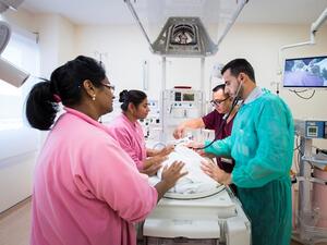 The multidisciplinary team at Women’s Hospital cares for a neonate in the NICU expansion