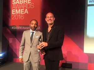OPR EMEA CEO Michael Frohlich receiving the trophy