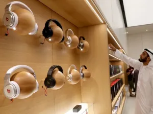 A customer looks at products displayed during the opening day of an Apple store at the Mall of the Emirates in Dubai on October 29, 2015. (AFP/ File)