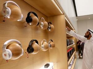 A customer looks at products displayed during the opening day of an Apple store at the Mall of the Emirates in Dubai on October 29, 2015. (AFP/ File)