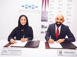 Shahla and Andrew signing the partnership agreement