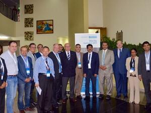 The organizing committee of the conference and speakers pose for a group photo