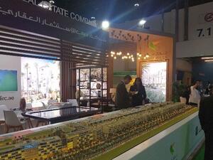 Visitors at the DIRC Mirdif Hills stand during Cityscape Abu Dhabi