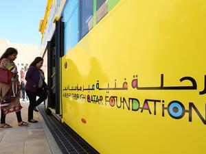 Attendees of round table board Doha Bus for a tour around Education City