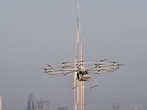 A video shows the flying taxi whirring through the sky before returning to base. (Gulf Business)