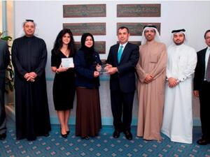 A group photo of Gulf Bank’s team receiving two Quality Recognition awards from Citibank representatives