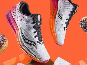 The Saucony x Dunkin' Kinarvara 9 shoes come in a box modeled after a Dunkin' Donuts box and feature the colors of the eatery's logo and a sprinkle-inspired design. (Courtesy of Saucony)