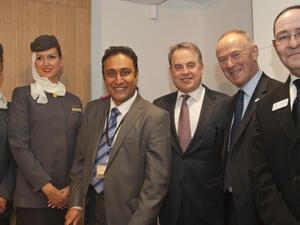Etihad Airways cabin crew, Etihad Airways Manager Manchester Contact Centre Sanjay Parmar, Etihad Airways President and Chief Executive Officer James Hogan, Manchester City Council Leader Sir Richard Leese and Manchester City Council Chief Executive Sir Howard Bernstein at the opening of the Etihad Airways Guest Contact