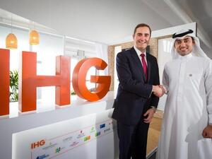 Pascal Gauvin and Sami Alhokair shake hands after signing the agreement. (Courtesy of IHG)