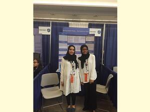 Winning team from Qatar with their project display board at Intel ISEF in the United States
