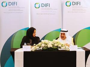Ms Noor Al Malki Al Jehani, Executive Director of Doha International Family Institute, signing a MoU alongside Mr. Aqeel Al Jassim, GCC Labour and Social Affairs Ministers' Council Executive Bureau Director General