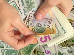 Kuwait government agrees with a proposal to tax remittances made by expatriates and denied that the Central Bank raised objections. (Shutterstock)