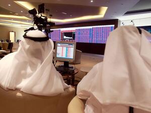 Traders monitor screens displaying stock information at Qatar Stock Exchange in Doha on June 5, 2017. (Reuters) Traders monitor screens displaying stock information at Qatar Stock Exchange in Doha on June 5, 2017. (Reuters)