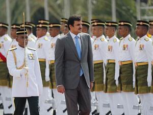 Qatar's Emir Sheikh Tamim bin Hamad Al Thani inspects an honor guard during a welcome ceremony in Kuala Lumpur, Malaysia, on October 16, 2017. (Vincent Thian/ AP) Qatar's Emir Sheikh Tamim bin Hamad Al Thani inspects an honor guard during a welcome ceremony in Kuala Lumpur, Malaysia, on October 16, 2017. (Vincent Thian/ AP)