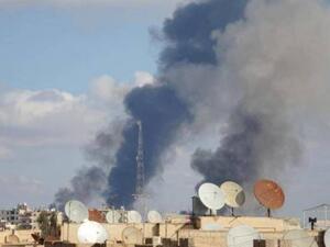 Smokes rises from the city of Raqqa after a US-backed airstrike. (AFP/File)