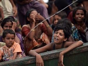 Rohingya Muslims flee violence in Myanmar (AFP/File Photo)