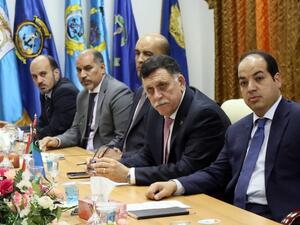 Libya's UN-backed Prime Minister-designate, Fayez al-Sarraj meets with members of the presidential council on March 31, 2016 in the capital Tripoli. (AFP/Mahmud Turkia)