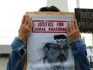 Humanitarian activists hold a poster with a picture of Jamal Khashoggi demonstrating in Makassar. Jamal Khashoggi, a journalist who was killed in Turkey (Shutterstock)