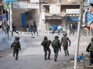  Israeli forces chase Palestinians (Shutterstock)