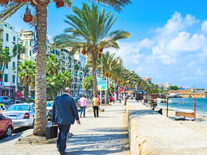 The comfortable promenade with the shady palms, numerous cafes and shops in the city centre in Alexandria. (Shutterstock/ File Photo)